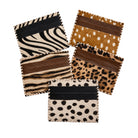 Four small cardholder or wallet pieces arranged on a white background, each made from different animal-print and solid leather materials. The visible designs include zebra print, brown-and-black stripes, tan-and-white spots, and brown-and-black spots.