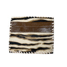 A small bifold wallet featuring a brown faux-leather top band and a zebra-print lower section with white fringed edges, shown on a plain white background.