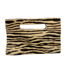 A small rectangular clutch bag with an integrated handle, featuring a black and tan zebra print pattern on a white background.
