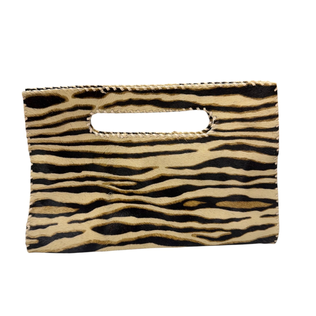 A small rectangular clutch bag with an integrated handle, featuring a black and tan zebra print pattern on a white background.