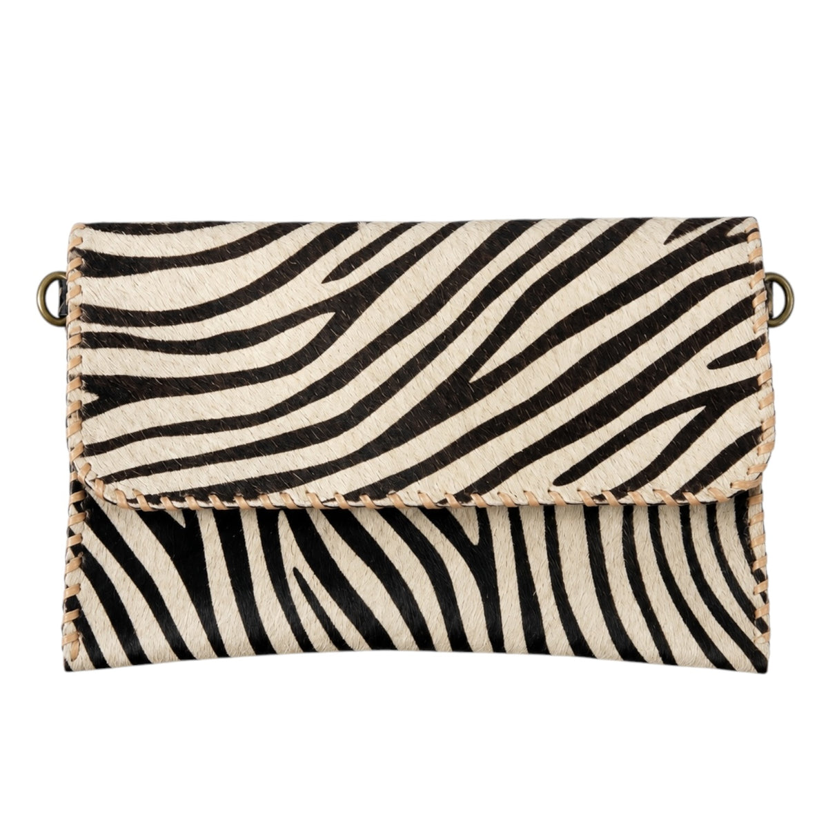 A zebra-print handbag with black and cream stripes, featuring a flap closure, whipstitched edges, and brass-tone hardware on a plain white background.