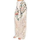 Floral and leopard print pants on a white background