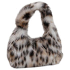 A plush faux-fur shoulder bag with a leopard print pattern in white, beige, and black, isolated on a white background.