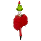 Pen with Grinch character on top, red fluffy ball, and gold accents on a white background