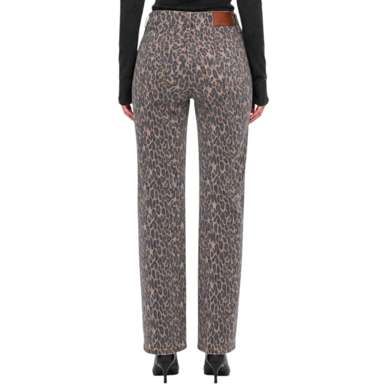 A pair of high-waisted leopard print trousers shown from the back on a model, paired with a black long-sleeve top and black heels against a plain white background.