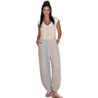 Woman wearing a patterned jumpsuit on a white background