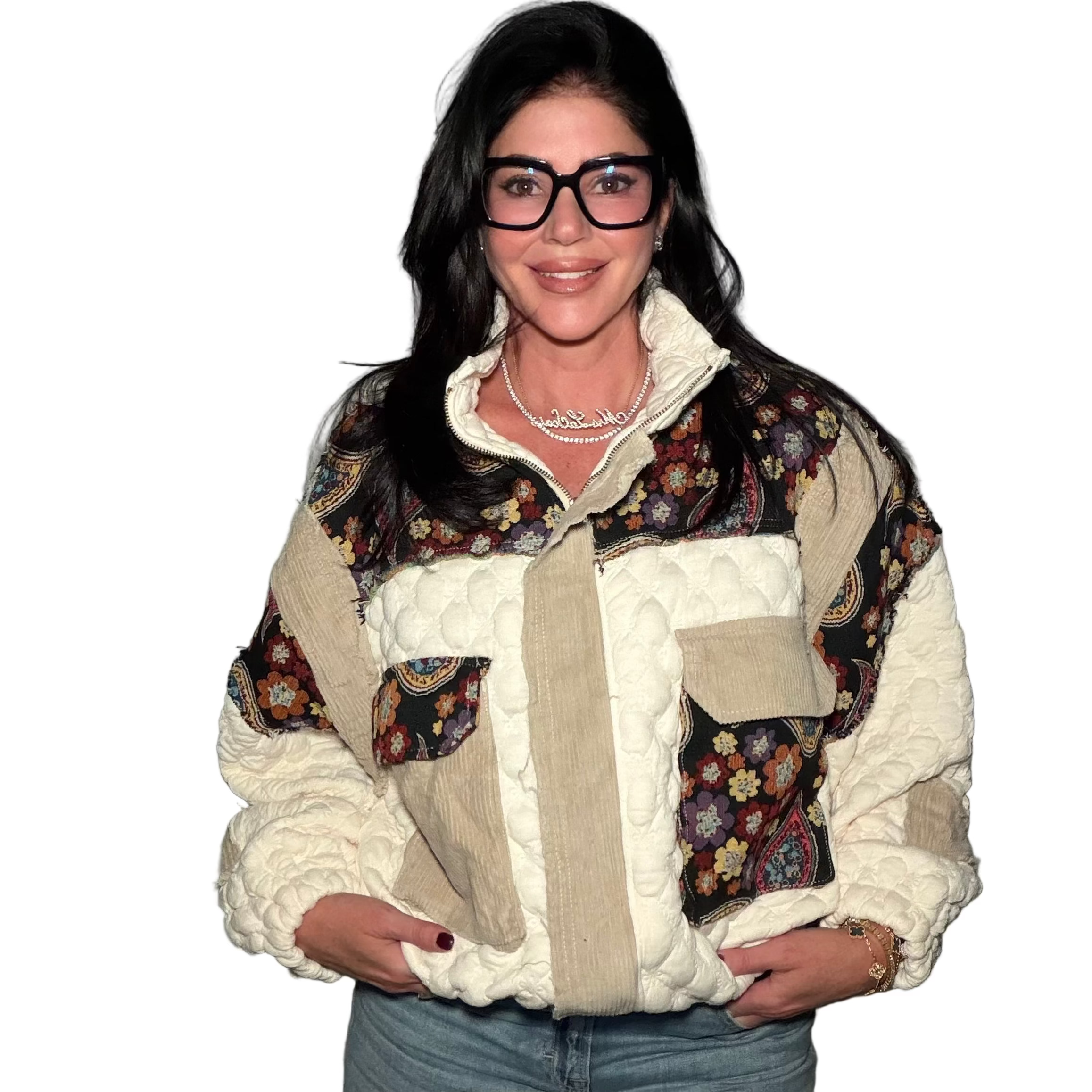 Woman wearing a patterned jacket with a neutral background