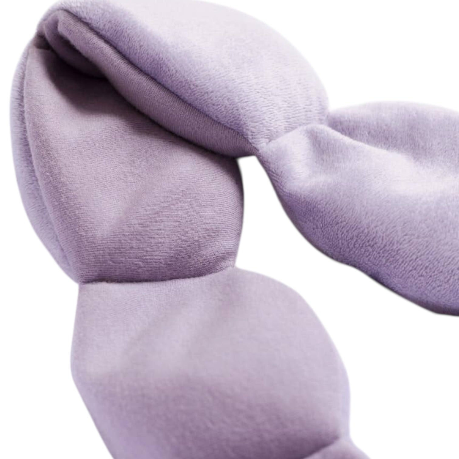 Close-up of a light purple eye mask on a white background