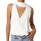 White sleeveless top with open back worn by a person on a white background