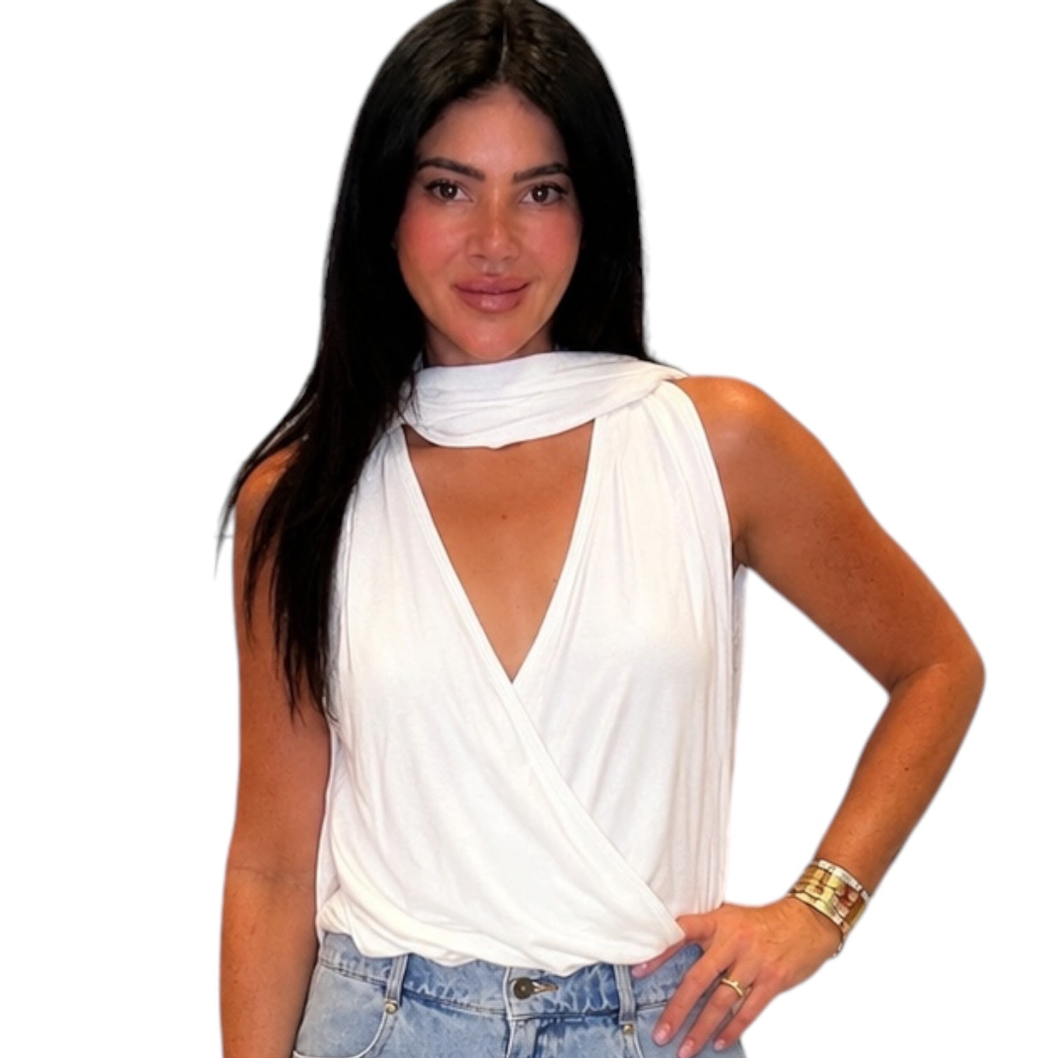 Woman wearing a white top and blue jeans on a white background