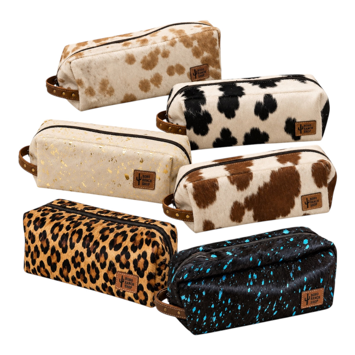 Six zippered pouches in different animal-print and speckled designs, arranged on a plain white background. The pouches include cow print, leopard print, and blue-tinted black splatter patterns, each with a small brown leather patch label.