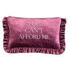 A dusty rose velvet clutch pouch with ruffled trim and the text 'YOU CAN'T AFFORD ME' printed in white on the front, set against a plain white background.