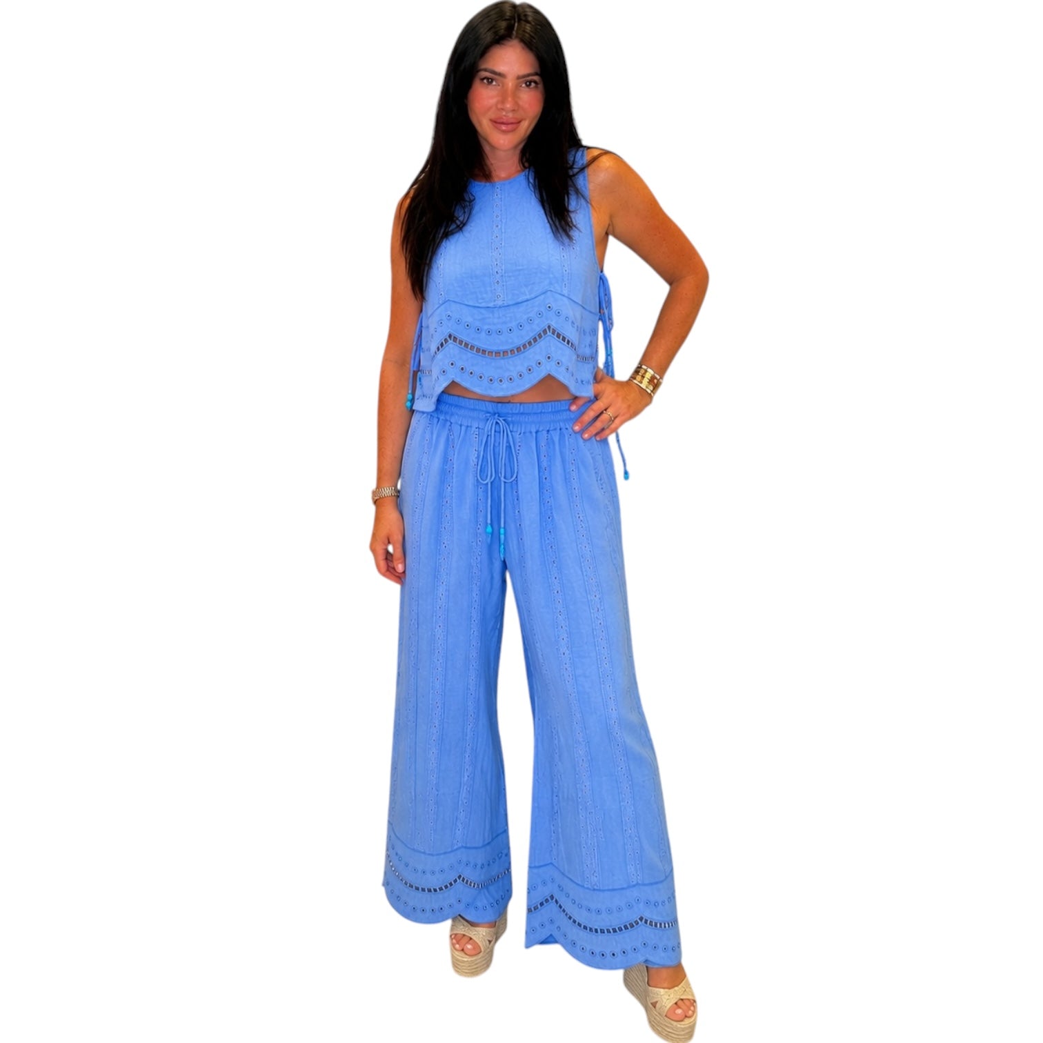 Woman wearing a blue outfit with a white background