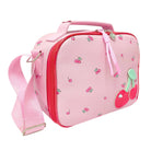 A pink soft-sided lunch bag with a cherry print, featuring a top handle, zippered closure, matching pink shoulder strap, and a large 3D cherry applique on the front.