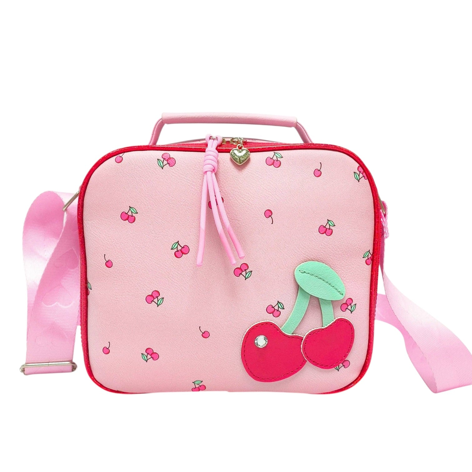 A pink lunch bag with a cherry pattern, featuring a large 3D cherry applique on the front, a pink top handle, and a matching pink shoulder strap.