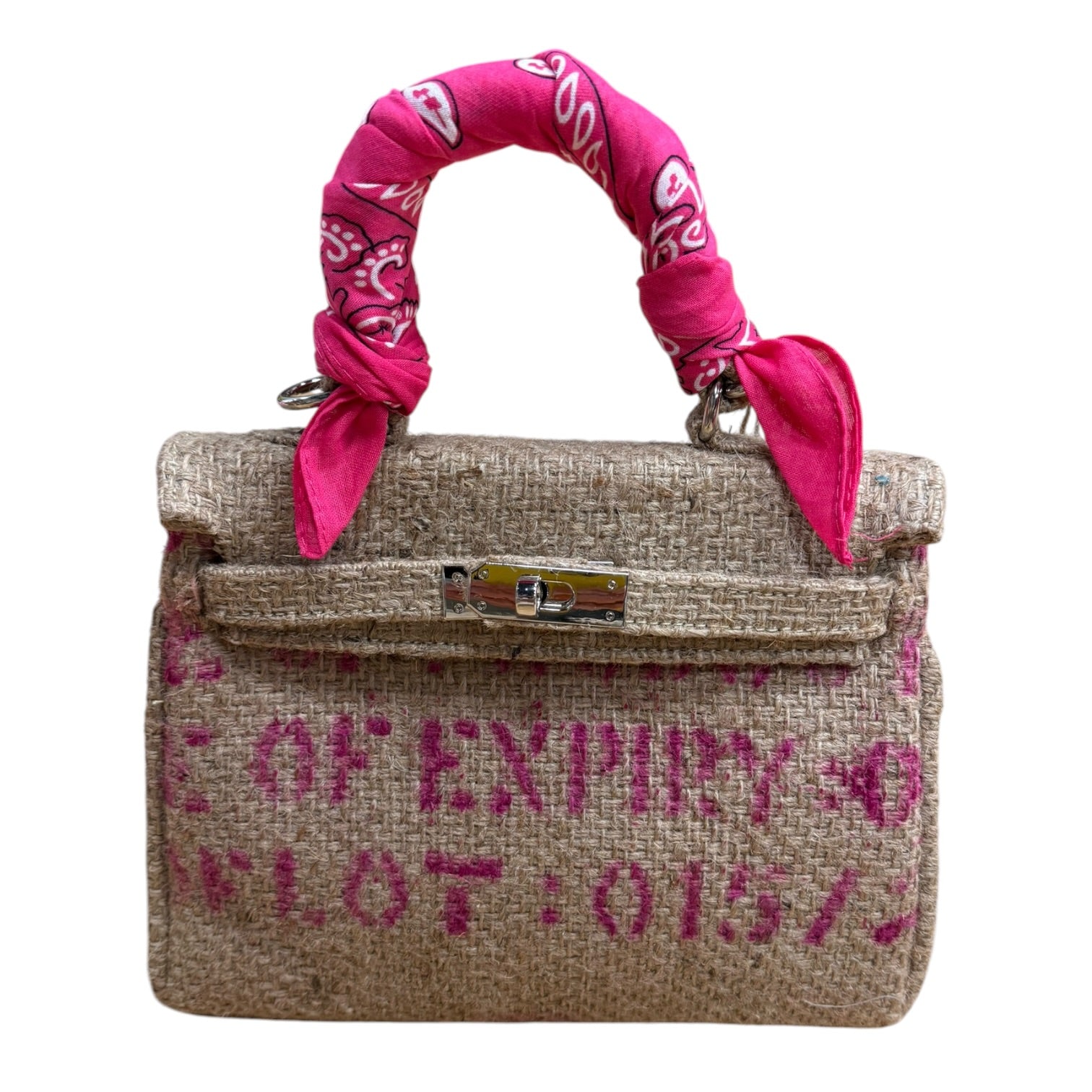 Handbag with pink bandana handle and text on a white background