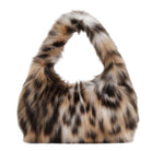 A fuzzy faux-fur shoulder bag with a leopard print pattern in brown, black, beige, and white, shown against a plain white background.