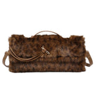 A brown faux fur clutch bag with a top handle, a detachable shoulder strap, and a small gold-tone clasp, shown against a plain white background.