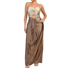 Woman wearing a strapless gown with a cutout design on a white background
