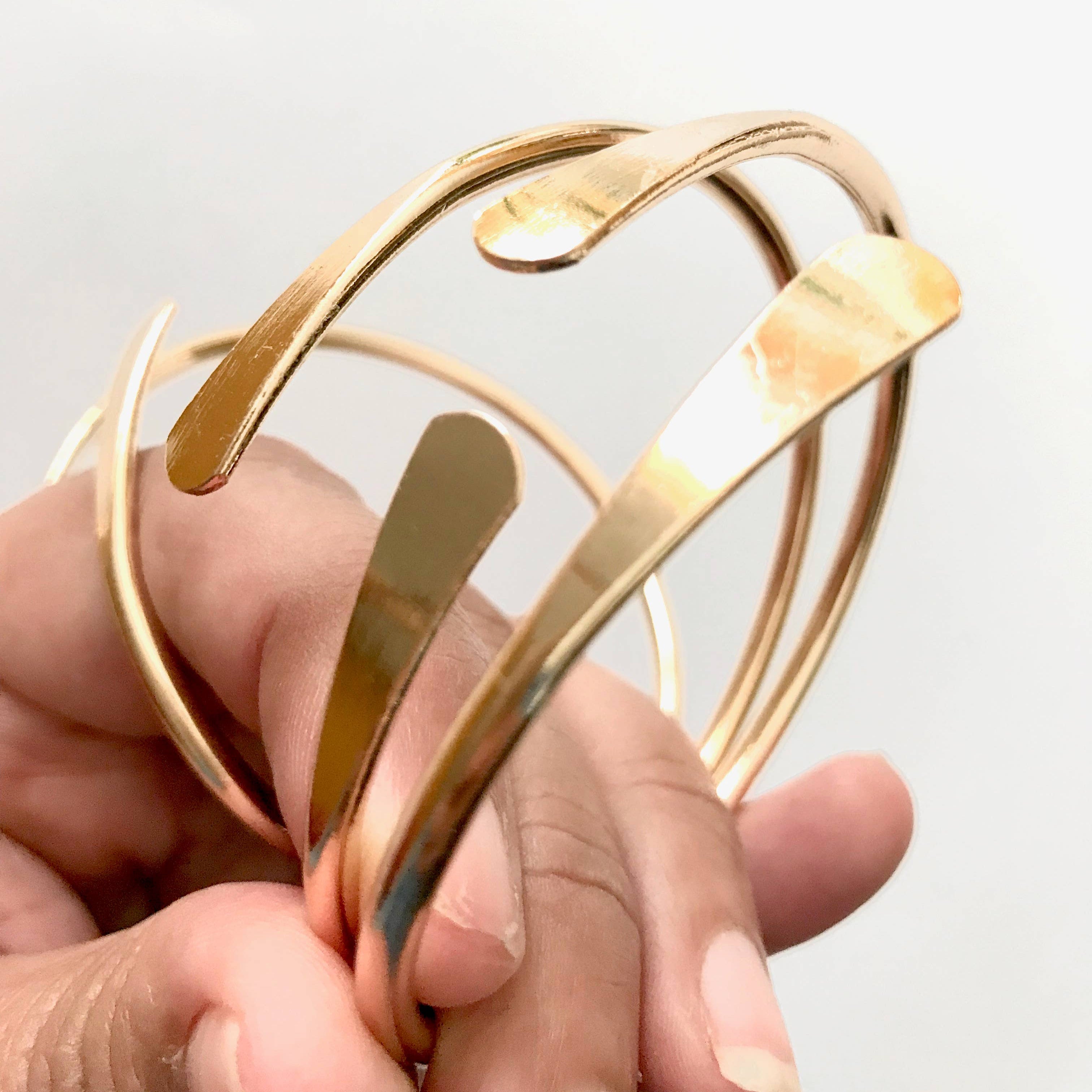 Golden Current Sculptural Cuff available at Alicia DiMichele Boutique – stylish women’s fashion and accessories.