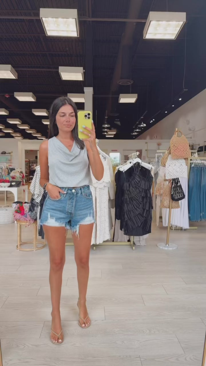 Mid-Rise Distressed Denim Shorts available at Alicia DiMichele Boutique – stylish women’s fashion and accessories.